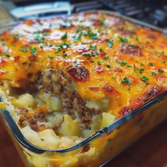 a casserole dish with meat and cheese in it