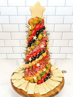 a christmas tree made out of crackers and vegetables