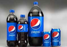 several pepsi sodas and cans are shown in this image, including one with the pepsi logo on it