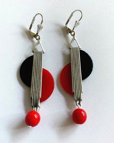 a stunning & unique pair of vintage art deco modernist earringsfantastic geometric shapesilver tone metal with cherry red & Black phenolic Bakelite, which is finished with Vintage Czech red glass drops - look stunning on !Earrings are handmade and reworked using true vintage 1930s Bakelite & galalith from my large collection. Each pair of earrings are unique and I will only make limited pairs in each design due to the rarity of vintage Bakelite.after the style of jakob bengel and sim Chrome Earrings, Art Deco Earrings Vintage, Modernist Earrings, European Jewelry, Deco Earrings, Jazz Age, Vintage Bakelite, Art Deco Earrings, Gorgeous Art