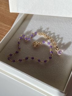 Worldwide free shipping by DHL Delicate bracelet made with small purple Amethyst faceted beads, wire wrapped by hand by using 22k Gold Vermeil wire. This bracelet is adjustable and has a cute 22k Gold Vermeil purple Amethyst charm attached to the end of the extension chain. Amethyst, which is a February birthstone, is considered to have strong calming and soothing as well as protection and purification properties. This bracelet comes in a lovely gift packaging and it is ready to ship. Purple Amethyst Bracelet For Gift, Gold Amethyst Beaded Bracelets, Amethyst Birthstone Beaded Bracelet Gift, Gold Beaded Amethyst Bracelets, Purple Amethyst Birthstone Bracelet, February Birthstone Necklace, Druzy Crystal, Rosary Bracelet, Birthstone Bracelet