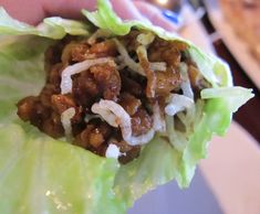 the lettuce is stuffed with meat and onions in it's wrapper