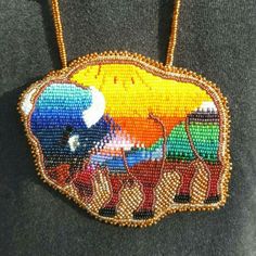 the beaded necklace is decorated with colorful images