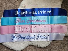 four ribbons that say miss america, miss america and the heartbreak prince