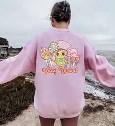 "Stay Weird Mushroom Sweatshirt, Stay Weird Sweater, Nature Mushroom Shirt, Magic Mushroom Hoodie, Psychedelic Shirt, Mushroom Hippie Hoodie Message for any details please!  ☀️☀️☀️☀️☀️ Everything in our shop is hand crafted and made to order. If you want different color or size contact me! If you would like something custom made to fit your personal style please message me and I will do everything to get you that something special. ---How To Order--- ⭐️Please, check and review all photos ⭐️Choose your t-shirt size and color ⭐️Enter your Design Color Example: \"White\" ⭐️Click add to cart. You can go back to add more product ⭐️Click \"Proceed to check out\" ⭐️When you check out, you can add a note to seller for any request *High quality and super soft, comfortable shirt. Made with top of th Casual Fall Sweatshirt With Mushroom Print, Casual Crew Neck Sweatshirt With Mushroom Print, Casual Mushroom Print Sweatshirt For Fall, Casual Long Sleeve Top With Mushroom Design, Cotton Sweatshirt With Mushroom Print, Cotton Long Sleeve Sweatshirt With Mushroom Print, Mushroom Sweatshirt, Mushroom Hoodie, Hippie Hoodie