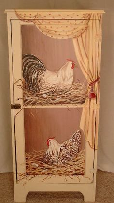 two chickens in a nest on top of a cabinet