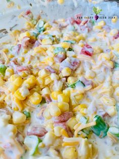 a mixture of corn and cheese in a glass bowl