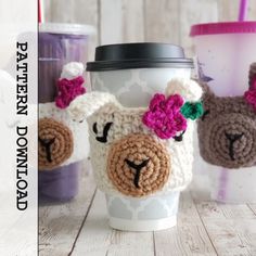 a coffee cup with some crocheted animals on it