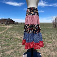 "^ Elastic Waist Handmade Novelty Western Mixed Fabric Tiered Ruffle Peasant Skirt. Fabric includes Cowboy boots, Red Check, Blue Bandana and Red & White Horseshoes. Size Label Vintage: no label Content: Cotton & Elastic Label: No label, Handmade * measurements taken flat * Waist: 15\" Flat ( 30\" Doubled) Length: 33\" * condition * Excellent Condition Feel free to ask questions Follow us on IG @bbwestvintage https://www.instagram.com/bbwestvintage/ I do not accept returns currently. Ple Red Patchwork Skirt For Spring, Spring Red Patchwork Skirt, Hippie Ruffled Skirt Bottoms For Spring, Bohemian Red Skirt For Fall, Peasant Style Tiered Skirt Bottoms With Ruffles, Peasant Style Tiered Skirt With Ruffles, Peasant Style Ruffled Tiered Skirt Bottoms, Fitted Peasant Tiered Skirt Bottoms, Peasant Style Fitted Tiered Skirt