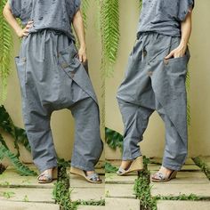 "Extravagant cotton chambray pants, avant garde pants, unisex harem pants, drop crotch pants, loose casual pants with 2 roomy patched pockets. I make these pants with elastic waist for comfort fit. Easy matching with any simple top. Material: 100% cotton chambray Status: ready to ship Model is 161 cm. tall with 28\" waist and 38\" hip Measurement: freesize pants (approximately) Elastic waist: 30\"-42\" (with adjustable drawstring) Hip: 54\" can fit up to hip max 50\" Total Length: 39.5\" (longes Avant Garde Pants, Chambray Pants, Drop Crotch Pants, Harem Pants Women, Ship Model, Simple Top, Pants Loose, Pants Casual, Loose Pants