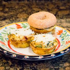 an egg muffin on a floral plate with another muffin in the background and sprinkled with shredded parmesan cheese