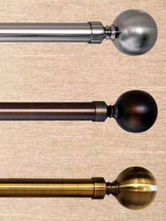 three different types of metal handles and pulls