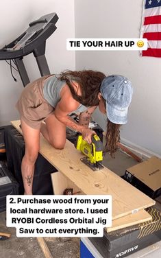 a woman is working on some wood with a cordless jig saw in her hand