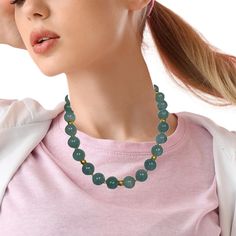 This stunning necklace features an impressive collection of large, 16mm round aquamarine beads with lovely, natural sea foam green color! The beads are beautifully matched, varying from pastel to deeper shades of a gorgeous and versatile color that looks more blue when worn with blue, and more green when worn with green! 18k yellow gold beads and accents elevate this gemstone necklace to fine jewelry status and make it a perfect complement to both warm and cool tones. This necklace pairs beautif Light Blue Necklace With Large Round Beads, Aquamarine Gemstone Necklaces With Round Beads, Aquamarine Beaded Necklace, Aquamarine Gemstone Round Bead Necklaces, Ocean-inspired Turquoise Round Beads Necklace, Green Aquamarine, Aquamarine Beads, Seafoam Green, Stunning Necklace