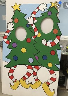 a cardboard cutout of two christmas trees