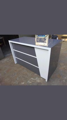 an office desk with two drawers on top