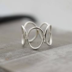 Sterling Silver Open Circle Ring Band - Bubble Ring - Midi Ring This simple sterling circle ring is a great addition to your wardrobe. It is a nice simple modern looking silver ring and so comfortable to wear. I start by making circles and then solder them together and form it into a ring, I then tumble it for hours to a beautiful shine. Each ring will be made to order in your size, please allow 5-7 business days for your ring to be made. Open Circle Ring, Grandmother Jewelry, Modern Silver Jewelry, Silver Ring Band, Bubble Ring, Handmade Sterling Silver Rings, Jewelry Sale, Midi Ring, Circle Ring