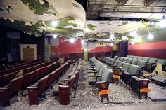 an empty auditorium with rows of seats in it