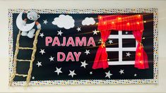 there is a sign that says pajama day with a ladder going up to the window