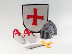 a crocheted hat, slippers and a knitted knight's helmet