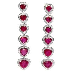 This 18K white gold elegant drop earrings are from our Timeless collection. These stud earrings are made of natural white diamonds in total of 0.60 Carat and natural heart red sapphires in total of 6.55 Carat. Total metal weight is 9 gr. They are 4.5 cm long. The Timeless Collection was inspired by the endless elegance and sophistication of classic high-jewelry, eternising it’s beauty and presenting a selection of classy designs. The intense colours stones give the collections authenticity making it memorable and distinguished from traditional timeless pieces, but it yet keeps the shapes and silhouettes of an art unchanged by time. The precious materials used on the craftsmanship of this collection guarantee that those pieces will last a life-time, making it the perfect present to be passe Ruby Drop Earrings, Diamond Red, Ruby Heart, Alexis Bittar Jewelry, Red Sapphire, Fancy Design, Heart Red, Animal Coloring, Alexis Bittar