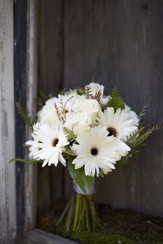 a bouquet of white flowers in a vase