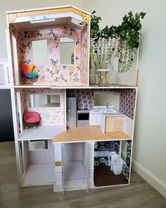 a doll house with all the furniture and accessories in it's display case,