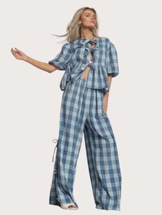 Unleash your fashion sense with these Gauze Bow Tie Pants! Made from light and airy gauze fabric, these plaid pants feature playful bow tie sides for a quirky touch. Perfect for adding a unique element to any outfit, these pants are sure to make a statement. Summer Plaid Pants For Loungewear, Summer Plaid Loungewear Pants, Spring Plaid Loungewear Pants, Trendy Plaid Pants For Summer, Spring Day Out Plaid Pants, Summer Gingham High-waisted Pants, Spring Plaid Wide-leg Pants, Plaid Wide-leg Pants For Spring, Trendy Gingham Pants For Summer