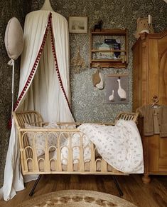 an old fashioned crib in the corner of a room