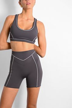 Made for a hike or for under your favorite oversized sweatshirt, the Christopher Contour Shorts feature contoured piping details and a high waisted fit. Wear alone or as a set with any of our Charcoal grey sports bras and tanks. Mid thigh length Thin, white contouring piping Dark charcoal coloring Double layered high waist Inseam length on size S: 5" Made of our VERSA fabric: smooth, buttery, and form fitting 85% polyamide, 15% spandex Your order will ship from our warehouse in FL, USA! Gray Sports Bra, Back Design, Charcoal Color, Oversized Sweatshirt, Waist Pants, Racer Back, Sports Bras, Scoop Neckline, Charcoal Grey