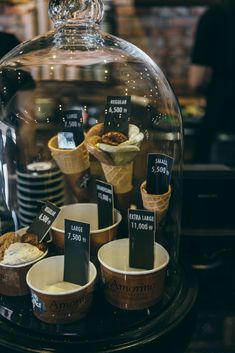 an ice cream display under a glass dome