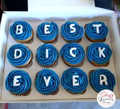 cupcakes with blue frosting in a box that says best dad ever on them