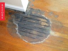 a wooden floor that has been cleaned and is next to a white door with the words before written on it