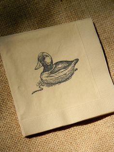 a napkin with a drawing of a duck on it