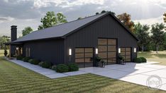 a garage with two cars parked in front of it on top of a grass covered field