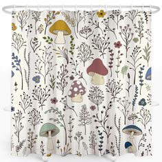 a shower curtain with mushrooms and flowers on it's side, in front of a white background