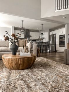 a living room filled with furniture and a large rug