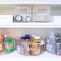 the shelves are organized with clear containers and toothbrushes