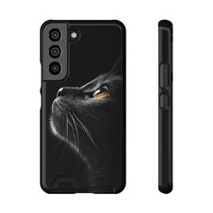 an iphone case with a black cat's face on the front and back cover