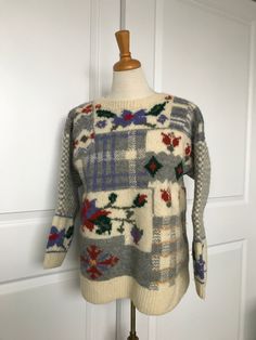 "Very thick wool sweater. Beautiful flower pattern with grey checkered pattern. Sized as S but is very generous sleeve and body style  that it easily fits size M. Excellent condition. Measurements: Armpit to armpit - 21\" Shoulder to bottom hem - 25\" Bottom width - 47\" End to end sleeves - 55\" Please note: - All my vintage items are sold as is. - I do my best to indicate flaws that I see and point them out in my description.  - Please review the photos before purchasing. - I  use recycled boxes & packing materials whenever I can. If you have any questions, please e-mail me. Thank you for visiting my shop." Winter Wool Sweater With Argyle Pattern, Wool Argyle Sweater For Winter, Plaid Wool Sweater For Winter, Red Napkins, Beaded Scarf, Autumn Knitwear, Flower Sweater, Daniel Hechter, Thick Wool