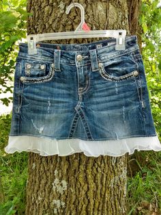 Cute and stylish upcycled Jean mini skirt! Adorable with boots or flats!  Made to order out of either MissMe , Grace in LA or L.A. Idol  jeans. Please contact me with any questions or concerns! I can make these with lace embellishment or without. Want it longer or shorter? Easy. :) Want it in a different color? Message me and we'll make you the skirt you dream about! Please note that the skirt pictured is not the exact skirt you will receive. All of our skirts are custom made to order and as jeans vary, the end product will vary slightly. If you have any specific requests, we would love to see what we can do! Cheap Denim Blue Mini Skirt With Button Closure, Homemade Skirts, Special Love Quotes, Mini Jean Skirt, Jean Mini Skirt, Recycled Jeans, Jean Mini Skirts, Upcycle Jeans, You Dream