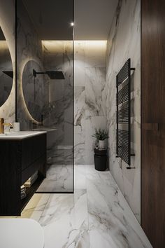 a modern bathroom with marble walls and flooring