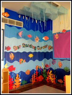 an ocean themed classroom with fish and corals on the wall