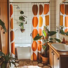 an orange and white bathroom with potted plants