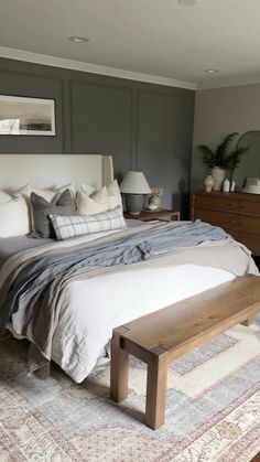 a large bed sitting in a bedroom on top of a rug