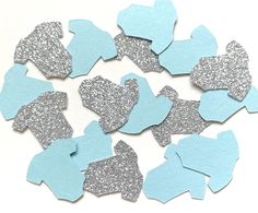 blue and silver paper cut out into hearts