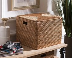 a wicker basket sitting on top of a wooden table