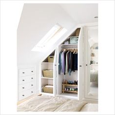 an open closet in the corner of a bedroom