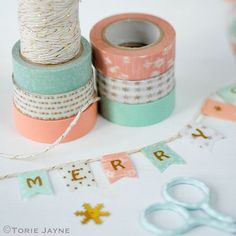 two rolls of washi tape sitting next to each other on top of a table