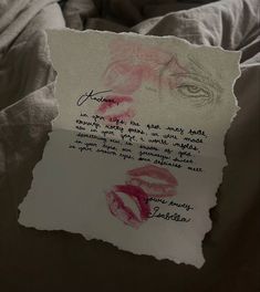 a piece of paper that has been written on it with some lipstick drawn on it